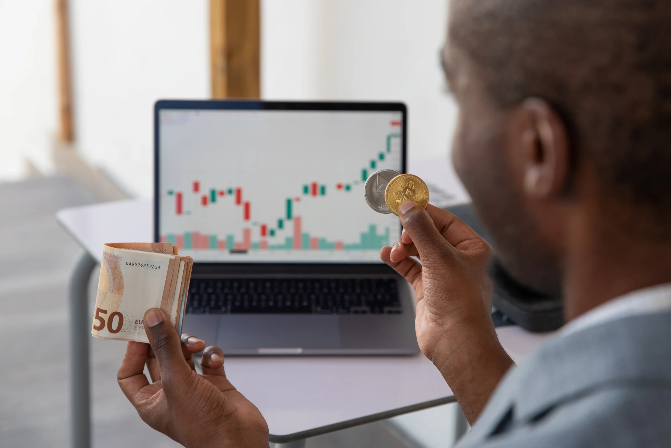 A trader using a Forex calculator to plan a trade