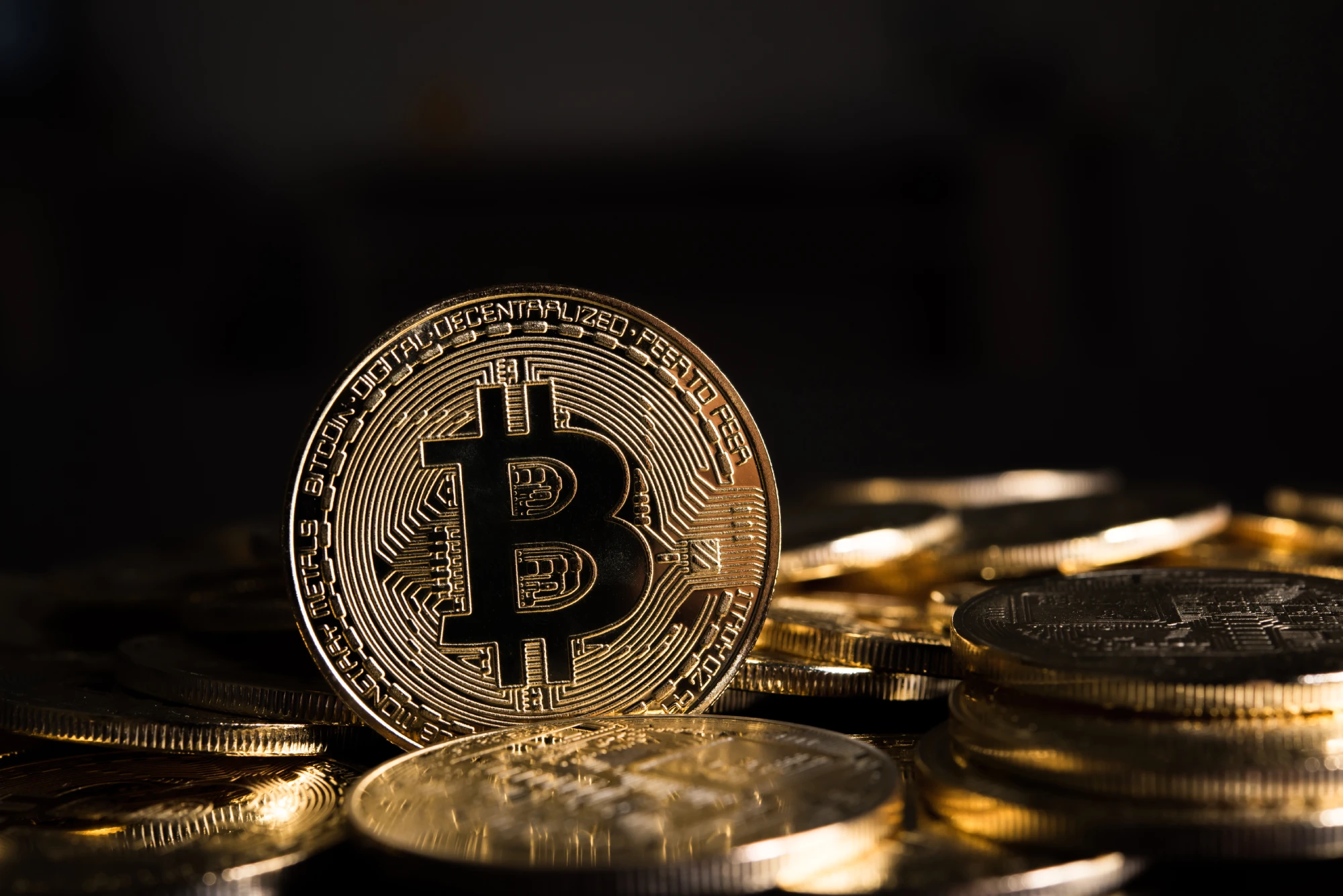 A glowing blockchain network with cryptocurrency icons floating in digital space.
